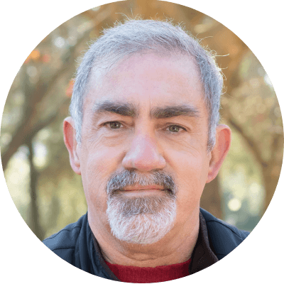 Smiling man in his 60s, headshot